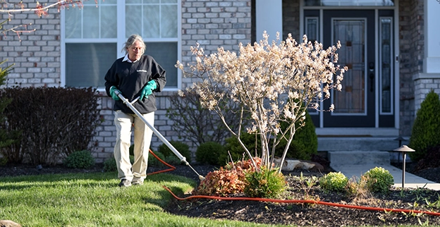 Edge trimming a lawn.