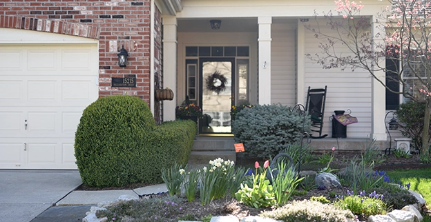 A house with a garden in front.