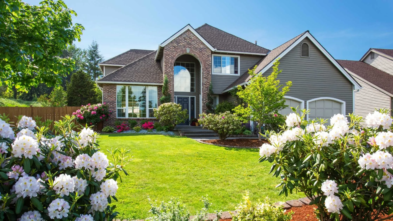 Exterior view of a luxury house with brick walls.