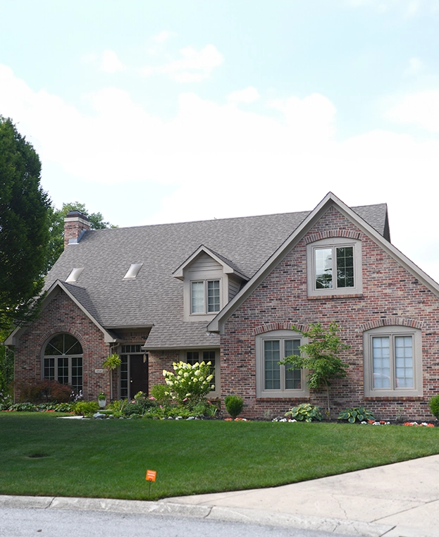 Picture of a house with a lush lawn