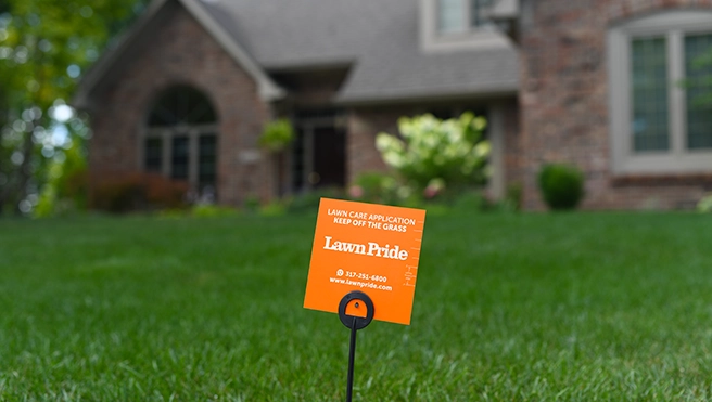 A Lawn Pride yard sign.